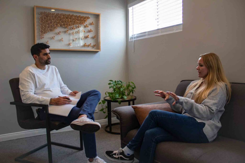 Photo of a teenage girl in a therapy session at teen mental health iop treatment in Los Angeles.